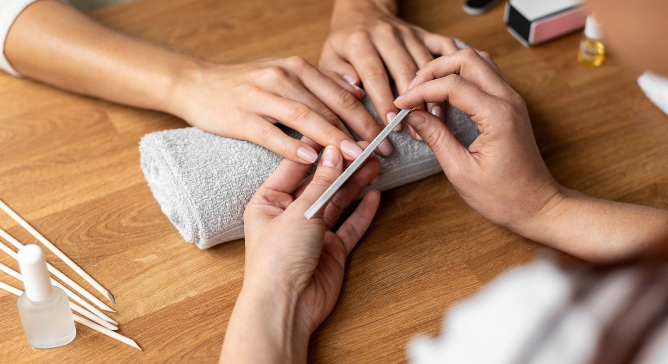 hands-holding-nail-file-close-up hands-holding-nail-file-close-up